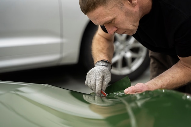 Free photo person working on car wrapping