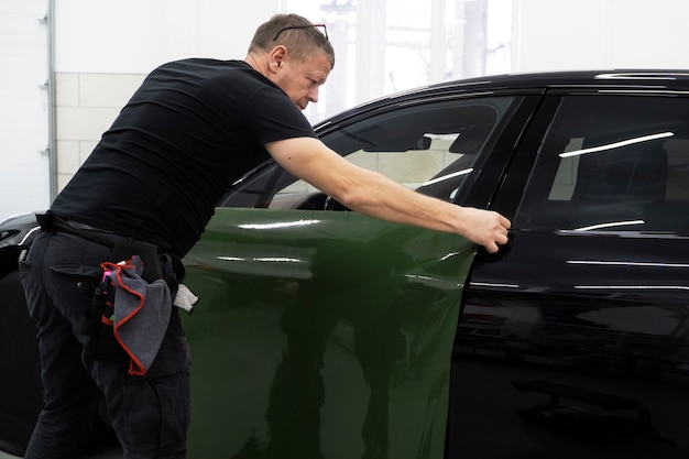 Person working on car wrapping