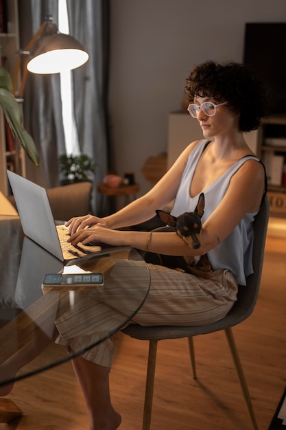 Free photo person working from home with pet dog