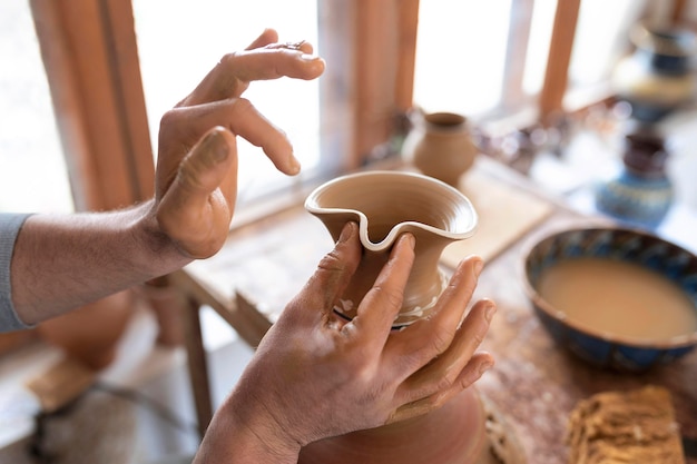 Person working in a pottery workshop