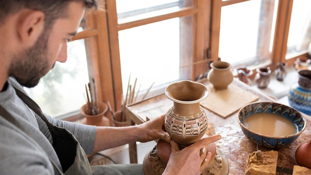 Person working in a pottery workshop