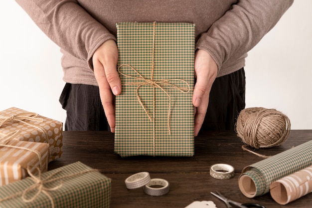 Person wrapping a christmas gift