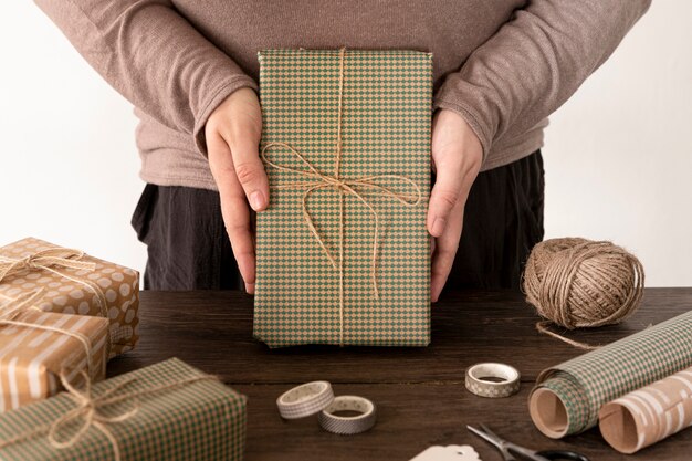 Person wrapping a christmas gift