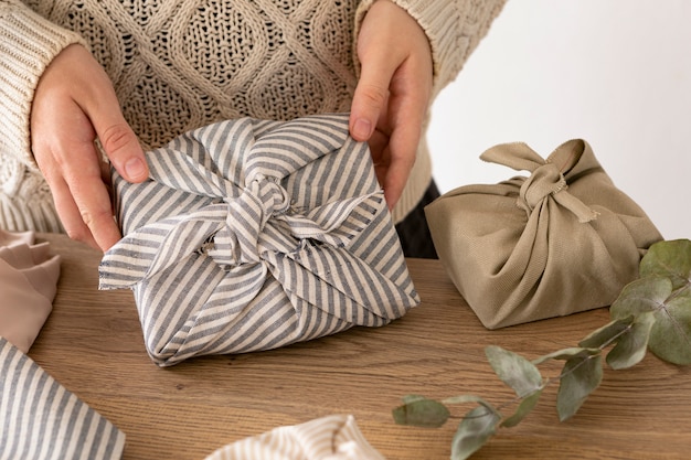 Person wrapping a christmas gift