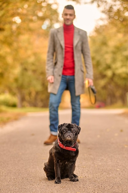 A pet owner on the walk with his friend