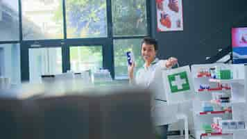 Free photo pharmacist providing products to clients