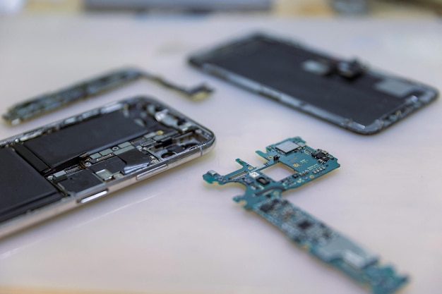 Phone repair concept several electronic devices taken apart into the components like the covers