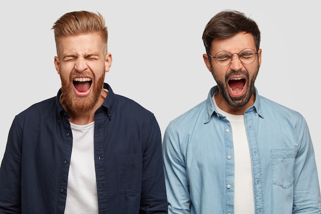 Free photo photo of annoyed guys produce loud yell