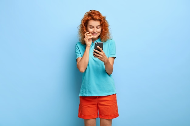 Photo of attractive millennial girl with ginger hair