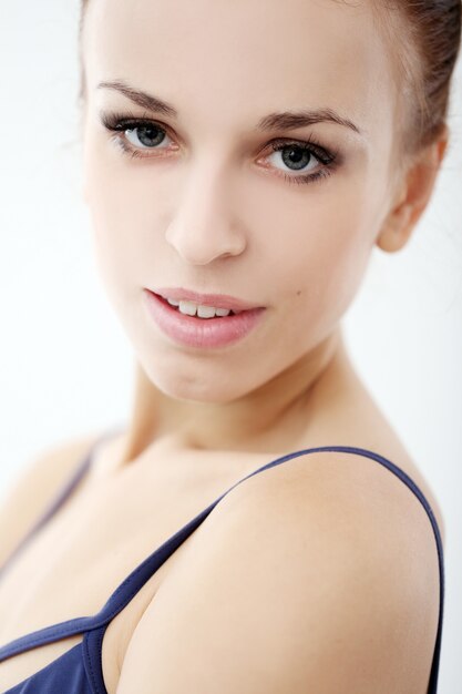 Photo of beautiful ballerina on white background