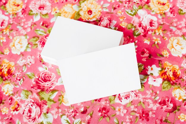 photo of business card blank mock up on beautiful floral background