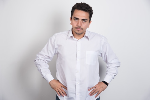 Free photo photo of businessman looking at camera on white background.