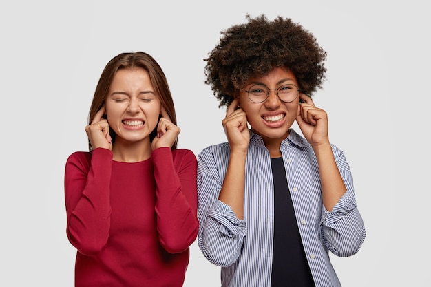 Free photo photo of displeased women plug ears