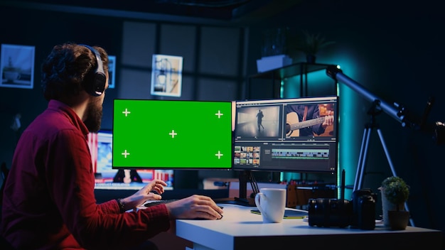 Photo editor selecting best photographs using retouching application on chroma key display