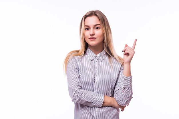 Photo of energetic nice smiling lady wearing grey top isolated on white wall pointing her finger in eureka sign, having great innovative idea, understanding or solution she has just got.