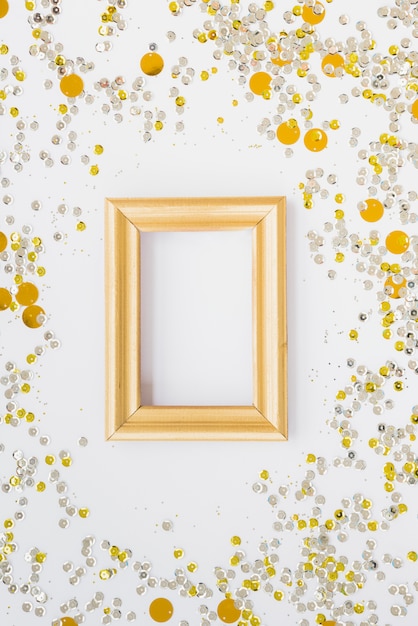 Photo frame between colourful confetti 