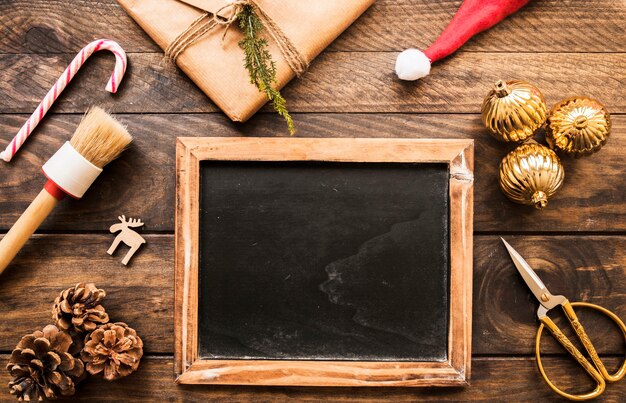 Photo frame near present box, snags and ornament balls