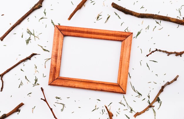 Free photo photo frame between twigs