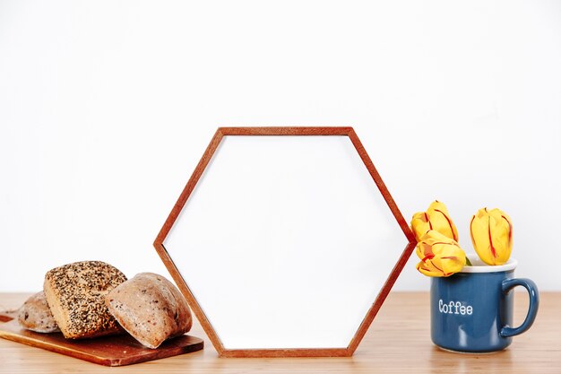 Photo frame with buns on table