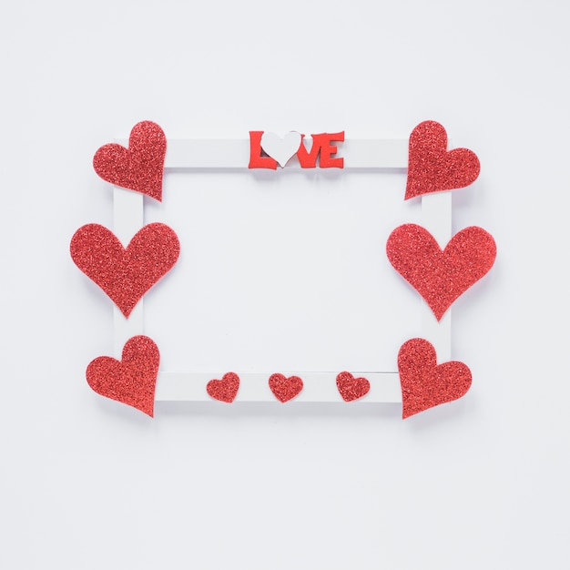 Photo frame with love title and heart symbols