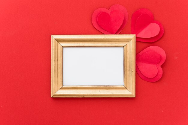 Photo frame with ornament paper hearts