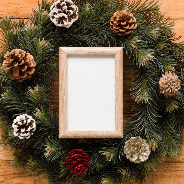 Photo frame between wreath with snags