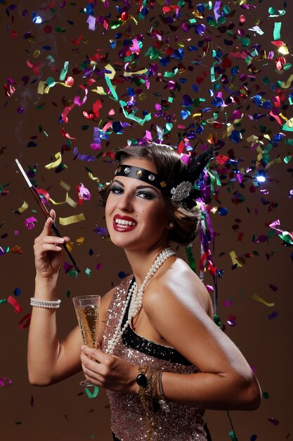 photo of happy party woman with confetta background