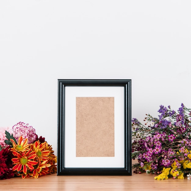 Photo holder among flowers