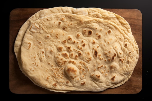 Free photo photo of homemade flat bread isolated on black background