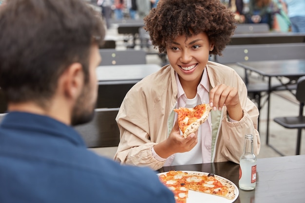 Photo of mixed race young family couple have tasty dish