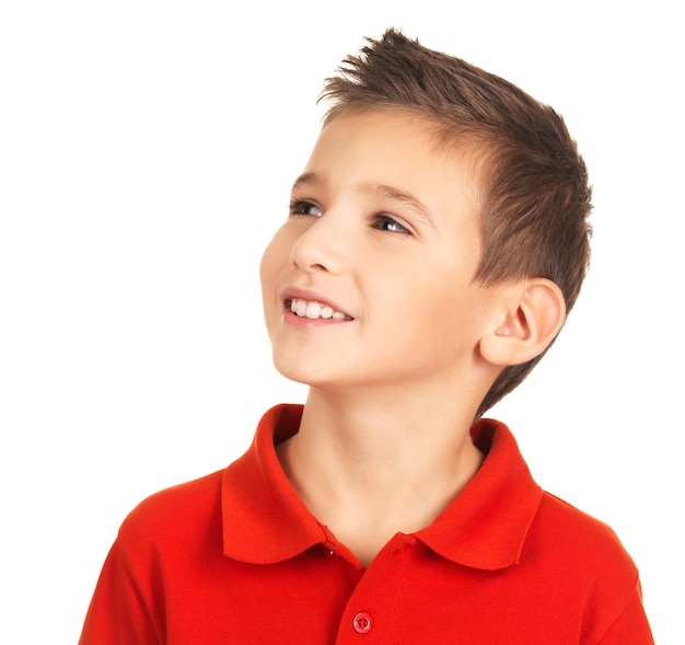 Photo of pretty young happy boy looking away