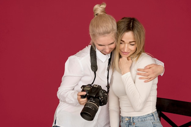 Photo shooting concept girls looking at photos