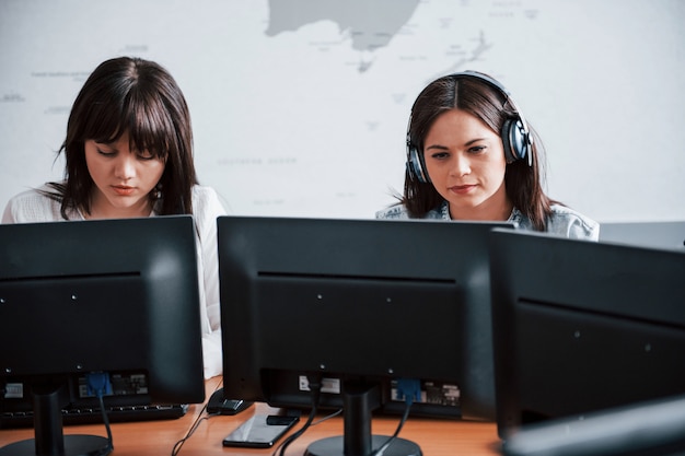 Free photo photo of two employees. young people working in the call center. new deals is coming