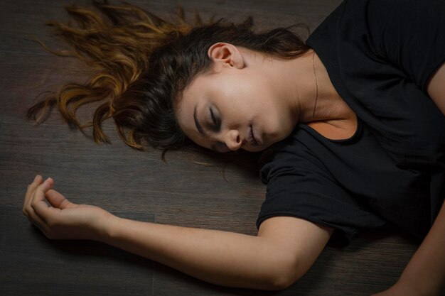 Photo of young girl on the floor. Suicide. High quality photo