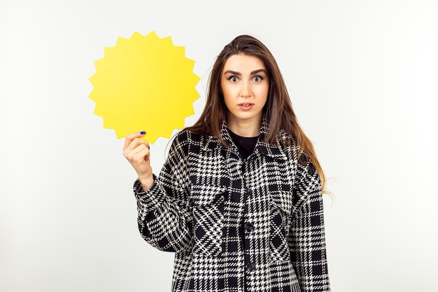 Photo of young lady holding idea board and standing on white background