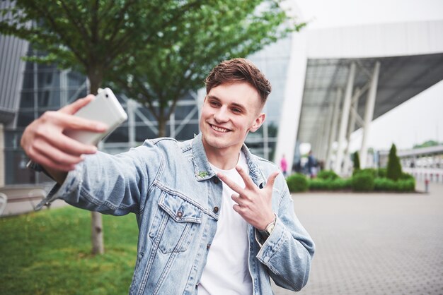 Photo of a young man before an exciting trip at the airport.