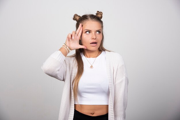 Photo of young woman looking away and posing .