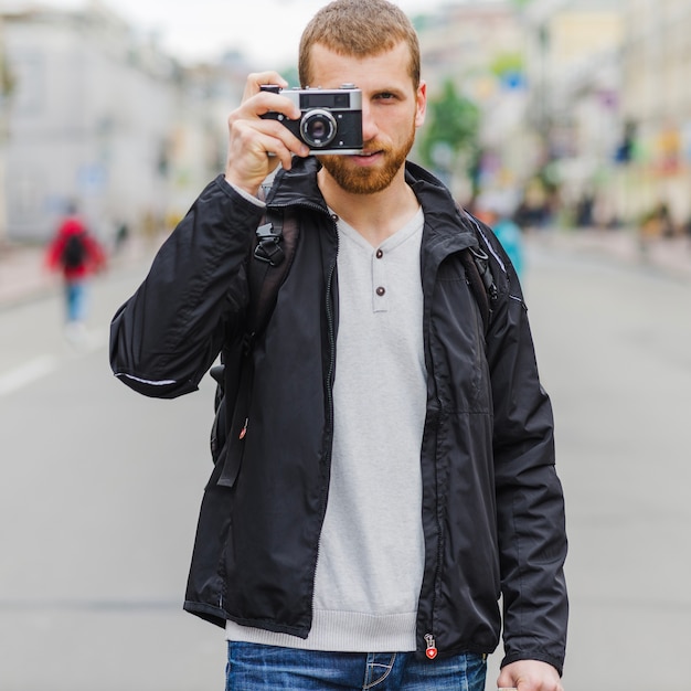 Photographer focusing at camera