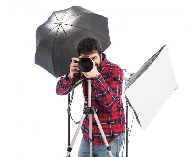 Free photo photographer in his studio