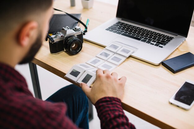 Photographer looking at negatives