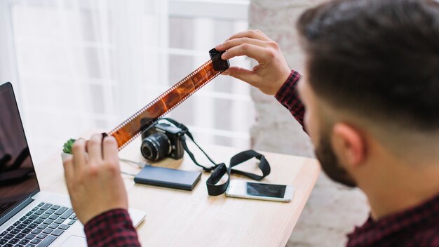 Photographer looking at negatives