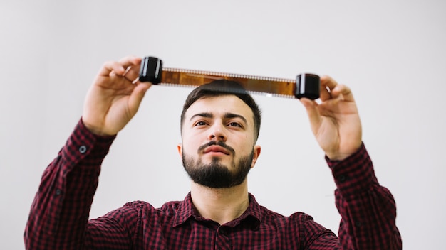 Photographer looking at negatives