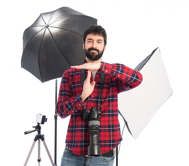 Photographer making time out gesture