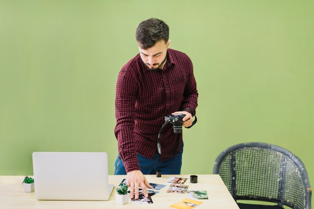 Photographer placing pictures