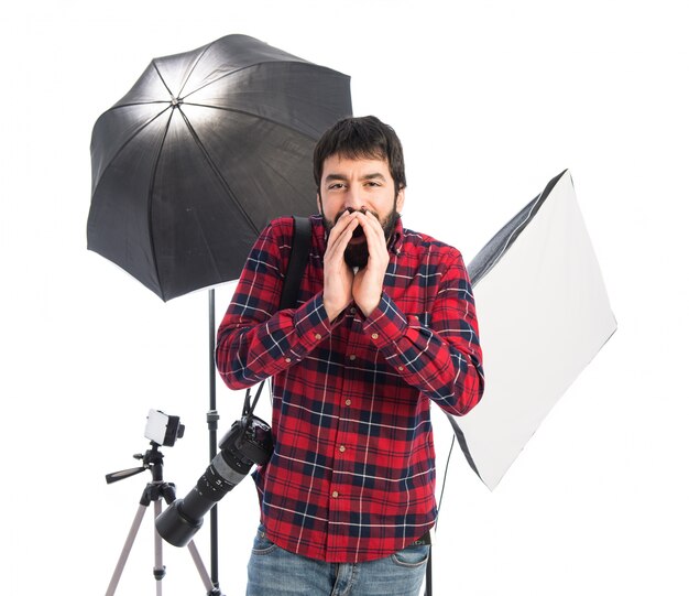 Photographer shouting over white background