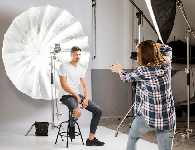 Photographer taking photos of handsome model