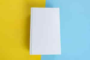 Free photo physical paper book over background closeup