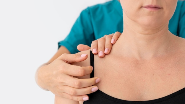 Physiotherapist helping a patient at her clinic