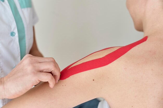 Physiotherapist undergoing therapy with female patient