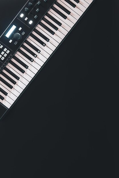 Piano keys synthesizer on a black background flat lay